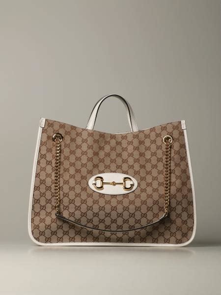 gucci bag官網|white Gucci shopping bag.